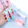 Tampilan samping keychain mechanical keyboard dengan base PVC solid